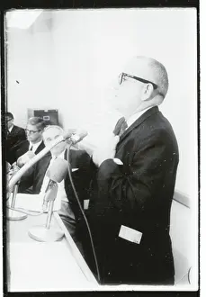 Austin Prints: Dr. Maurice Dean Heatly Standing at Microphones