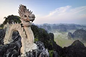 Vietnamese Prints: Dragon sculpture on a limestone hill