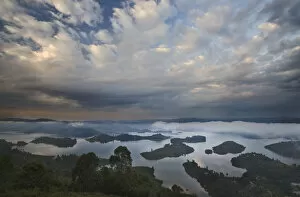 Mist Collection: Dramatic clouds and fog at sunrise above the islands of Bunyonyi Lake, Kisoro, southwestern Uganda