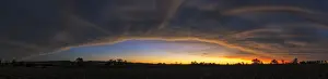Dramatic Panoramic Sunset Landscape with the cloud formation forming a big eye in the sky. Magaliesburg, Gauteng Province, South Africa