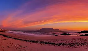 Dramatic Pink Sunset over Table Mountain from Blauwbergstrand Beach, Cape Town, Western Province, South Africa