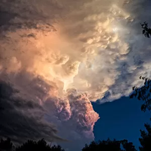 Weather Gallery: Dramatic storm clouds rolling in at sunset before