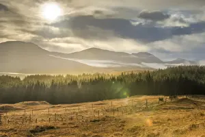 Matt Anderson Photography Prints: Dramatic sunset with atmospheric clouds over the mountainous Scottish landscape