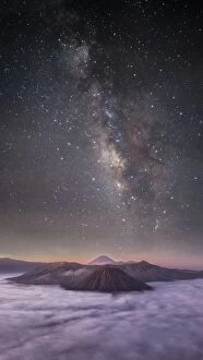 Milky Way Gallery: Dreamlike Milky way and mountain range before morning sunrise at bromo volcano mountain with