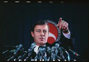 Drew Lewis Pointing at News Conference