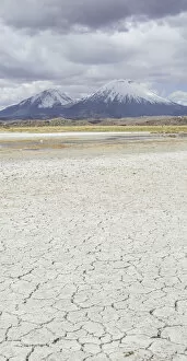 Dried up salt lake with the volcanos Parinacota, left, and Pomerape, right, Putre, Arica and Parinacota Region, Chile