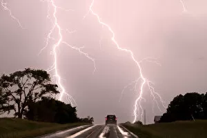 Lightning Storms Gallery: Driving into the storm, Double lightning bolts over highway. Nebraska. USA