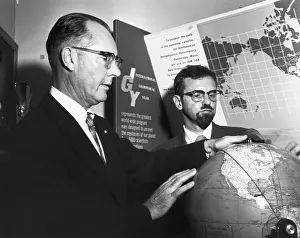 Satellite Prints: Drs. Whipple And Hynek Looking At Globe
