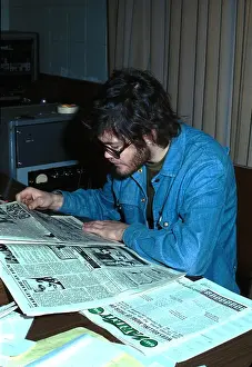 Prints of LOS ANGELES - 1969: Drummer and singer Mickey Dolenz of the Pop band The Monkees reads the newspaper in 1969 in Los Angeles. (Photo by Michael Ochs Archives/Getty Images) Hey Hey, It’s The Monkees: Prints Celebrating Pop’s Most Playful Phenomenon: Drummer and singer Mickey Dolenz of the Pop band The Monkees