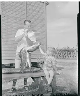 Duke and Kevin Snider Admiring Fish