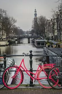 Netherlands Collection: A Dutch Bicycle Parked on an Amsterdam Canal Bridge