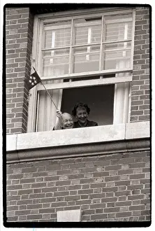 Dwight Eisenhower Waves Flag from Window
