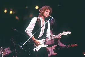 Prints of ATLANTA - DECEMBER 12: Bob Dylan performing onstage playing his Fender Stratocaster electric guitar and wearing a vest on December 12, 1978 at the Omni in Atlanta, Georgia Blowin' in the Wind: Bob Dylan's Photographic Legacy: Dylan Performs In Atlanta