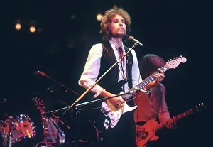 Prints of ATLANTA - DECEMBER 12: Bob Dylan performing onstage playing his Fender Stratocaster electric guitar and wearing a vest on December 12, 1978 at the Omni in Atlanta, Georgia Blowin' in the Wind: Bob Dylan's Photographic Legacy: Dylan Performs In Atlanta