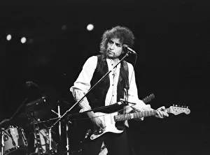 Prints of ATLANTA - DECEMBER 12: Bob Dylan performing onstage playing his Fender Stratocaster electric guitar and wearing a vest on December 12, 1978 at the Omni in Atlanta, Georgia Blowin' in the Wind: Bob Dylan's Photographic Legacy: Dylan Performs In Atlanta