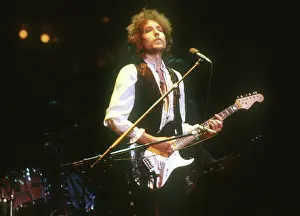 Prints of ATLANTA - DECEMBER 12: Bob Dylan performing onstage playing his Fender Stratocaster electric guitar and wearing a vest on December 12, 1978 at the Omni in Atlanta, Georgia Blowin' in the Wind: Bob Dylan's Photographic Legacy: Dylan Performs In Atlanta