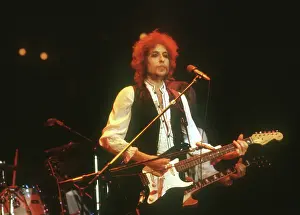 Prints of ATLANTA - DECEMBER 12: Bob Dylan performing onstage playing his Fender Stratocaster electric guitar and wearing a vest on December 12, 1978 at the Omni in Atlanta, Georgia Blowin' in the Wind: Bob Dylan's Photographic Legacy: Dylan Performs In Atlanta