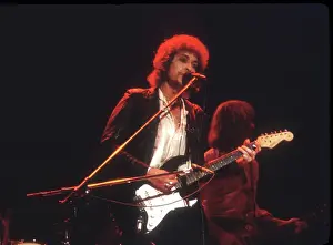 Prints of SAVANNAH, GA - DECEMBER 8: Bob Dylan performing onstage playing his Fender Stratocaster electric guitar on December 8, 1978 at the Civic Center Arena in Savannah, Georgia Blowin' in the Wind: Bob Dylan's Photographic Legacy: Dylan Performs In Savannah