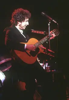 Dylan Plays Acoustic Guitar