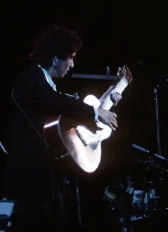 Dylan Plays Acoustic Guitar