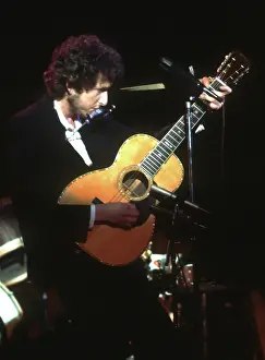 Dylan Plays Acoustic Guitar