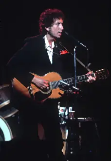 Dylan Plays Acoustic Guitar