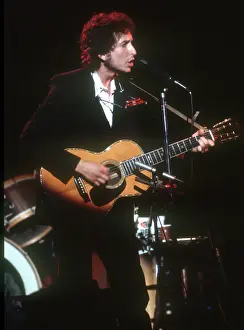 Dylan Plays Acoustic Guitar