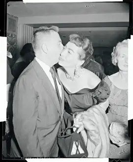 Prints of (Original Caption) A Glamorous Life Captured: Earl Wilson Kissing Joan Crawford