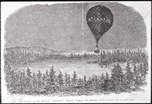 Early Balloon in Flight over Wooded Lake Area
