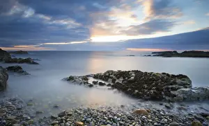 Beau Prints: Early morning landscape of ocean over rocky shore with glowing sunrise - Findochty