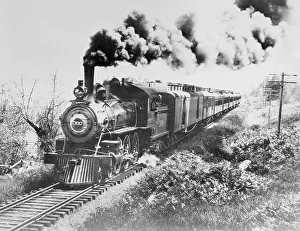 Early Passenger Train Passing Through Rural Area