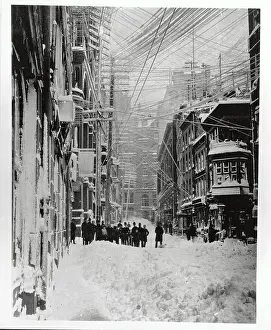 Early Snow Scene in New York City with Group of People