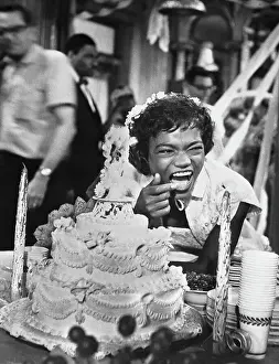 Prints of (Original Caption). Singer Eartha Kitt stops the cameras as she doubles up with laughter during the wedding-festivity scene of Anna Lucasta, a United Artists release Captivating Art Prints Celebrating the Iconic Performer’s Legacy: Eartha Kitt Laughing