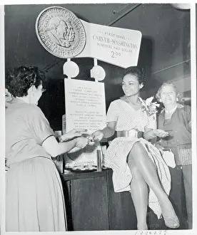 Prints of (Original Caption). Broadway star Eartha Kitt (center) of New Faces of 1952, handles the usual job of selling money in a special program to aid the Booker T Captivating Art Prints Celebrating the Iconic Performer’s Legacy: Eartha Kitt Selling the New Half Dollars