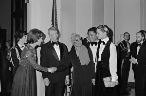 Prints of (Original Caption). President and Mrs. Carter meet Eartha Kitt and her daughter Kit McDonald in this photo, at a reception at the White House on January 29th Captivating Art Prints Celebrating the Iconic Performer’s Legacy: Eartha Kitt Shaking Hand of Rosyln Carter