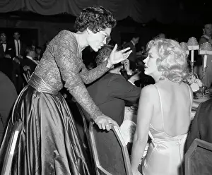 Prints of (Original Caption). Stage star Eartha Kitt is shown here chatting with Marilyn Monroe at the Milk Fund dinner Captivating Art Prints Celebrating the Iconic Performer’s Legacy: Eartha Kitt Talking with Marilyn Monroe