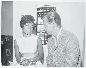 Prints of (Original Caption). Singer Eartha Kitt sits at the Marriage License Bureau with her fiance, Real Estate Investor William McDonald, as they await the Issuance of a marriage license Captivating Art Prints Celebrating the Iconic Performer’s Legacy: Eartha Kitt Waiting with Fiance William McDonald