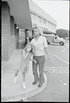 Prints of (Original Caption). Songstress Eartha Kitt and her 6-year-old daughter Kitt McDonald leave Central Receiving Hospital after they and producer Lamont Johnson were involved in a car wreck Captivating Art Prints Celebrating the Iconic Performer’s Legacy: Eartha Kitt Walking with Daughter Kitt McDonald