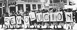 Ecuadorean Farmers Hold Placards spelling the Word Revolucion