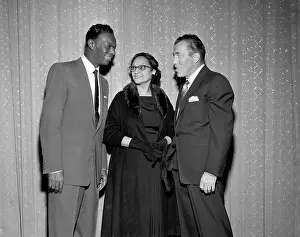 Prints of NEW YORK - MAY 16: Entertainer and pianist Nat King Cole chats with host of The Ed Sullivan Show Ed Sullivan and a woman on May 16, 1954 in New York City, New York A Musical Icon: The Ed Sullivan Show Chat
