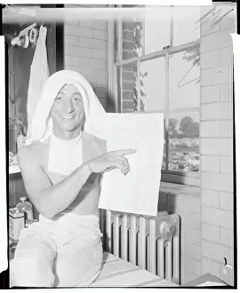 Elmont Prints: Eddie Arcaro Holding Race List