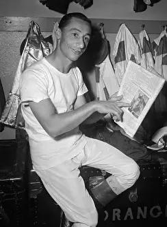 Eddie Arcaro Pointing to Whirlaway in Newspaper