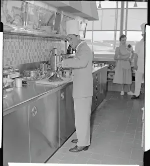 Eddie Arcaro Wearing Chef Hat While Cooking
