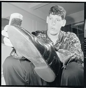 Eddie Carmel Polishing His Shoes