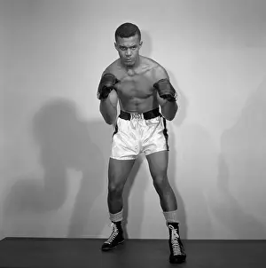 Prints of BRONX, NY - AUGUST 19: Middleweight professional boxer Eddie Dixon of the United States poses for a portrait on August 19, 1958 in the Bronx, New York. (Photo by Stanley Weston/Getty Images) In the Ring: The Art of Boxing: Eddie Dixon Studio Portrait