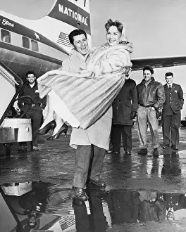 Eddie Fisher Carrying Debbie Reynolds