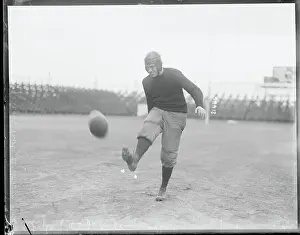 Eddie Mahan Kicking Football