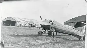 Edward F. Hinkle Standing by Plane
