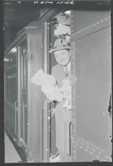 Edward G Prints: Edward G. Robinson Holding Toys