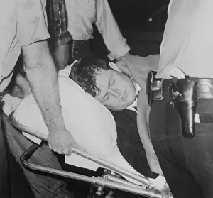 Edward Kennedy Laying on a Stretcher